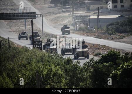 Idlib, Syria. 12th Aug, 2020. The Russian Military and the Turkish military conducted their 24th joint patrol on the M4 highway in the northwestern Syria region of Greater Idlib, on August 12, 2020. The joint patrol set off from the town of Tronba in southern Idlib and reached the town of Ain Hawr in northern Lattakia, completing its entire route. No incidents whatsoever were reported during the patrol. (Photo by Azalden Idlib/INA Photo Agency/Sipa USA) Credit: Sipa USA/Alamy Live News Stock Photo