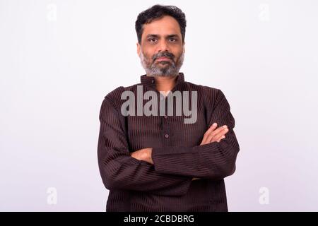 Portrait of mature handsome bearded Indian businessman Stock Photo