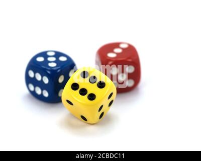 Three colorful dice against white background Stock Photo