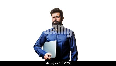 Young businessman using his laptop, pc. Holding laptop computer. Serious handsome bearded man worker laptop Stock Photo