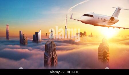 Private jet plane flying above Dubai city in beautiful sunset light. Modern and fastest mode of transportation, business life. Stock Photo