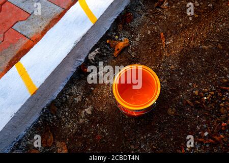 a top view of yellow color paint can isolated on ground Stock Photo