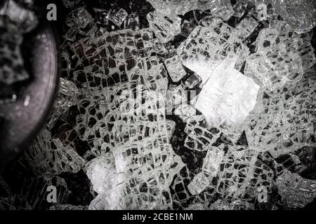 Broken glass texture on a black background Stock Photo