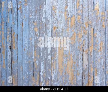 old blue cracked paint on vertical wooden planks Stock Photo