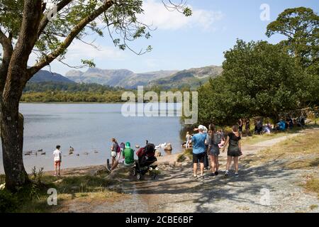 people on day trips and staycation holidays on elterwater lake district cumbria england uk Stock Photo