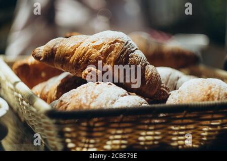 croissants in a wicker basket Stock Photo