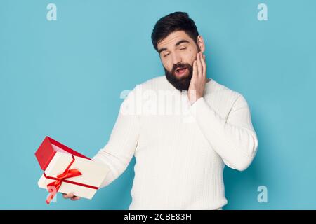 Bearded man gift holiday birthday emotion surprise  Stock Photo