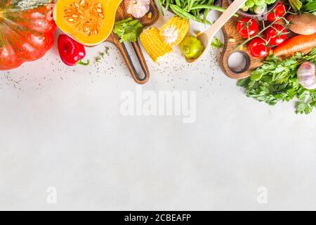Autumn cooking background. Organic autumn harvest vegetables, raw vegan ingredients for cooking traditional thanksgiving and fall food on white backgr Stock Photo