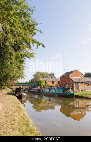 Crick, Northamptonshire, UK - 12/08/20: Narrowboats moored at Crick Wharf on the Grand Union Canal, a popular route for boating holidays. Stock Photo