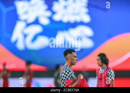 Israeli football player Eran Zahavi of Guangzhou R&F F.C. prepares for the third-round match of 2020 Chinese Super League (CSL) against Henan Jianye F.C., Dalian city, northeast China's Liaoning province, 5 August 2020. Henan Jianye F.C. and Guangzhou R&F F.C. drew the game with 1-1. Stock Photo