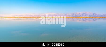 Dead Sea, Israel view east into the drying sea The resort hotels of Ein Bokek in the background Stock Photo