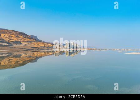 Dead Sea, Israel view east into the drying sea The resort hotels of Ein Bokek in the background Stock Photo