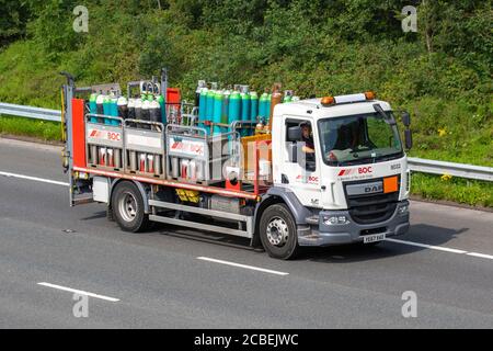 BOC, Linde Group Industrial Gases being transported on a DAF LF HGV on the M6 near Lancaster, UK Stock Photo