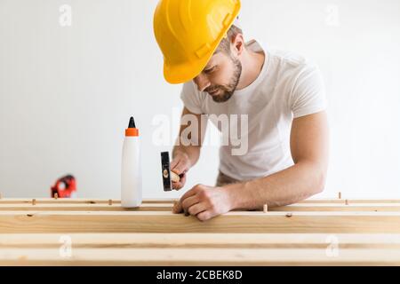 Male carpenter working on a project in his workshop Stock Photo