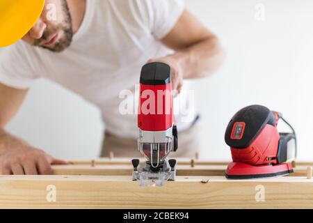 Male carpenter working on a project in his workshop Stock Photo