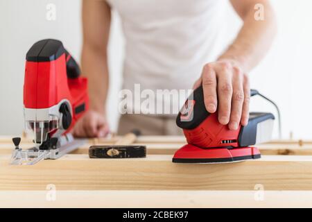 Male carpenter working on a project in his workshop Stock Photo