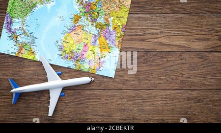 airplane map on table background. concept of plane travel. Empty space for text - booking a flight ticke  - 3d illustration Stock Photo