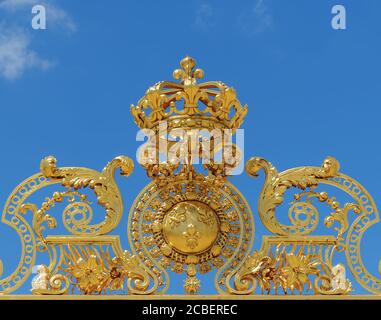 Golden gate of Chateau de Versailles with blue sky - Versailles, France Stock Photo