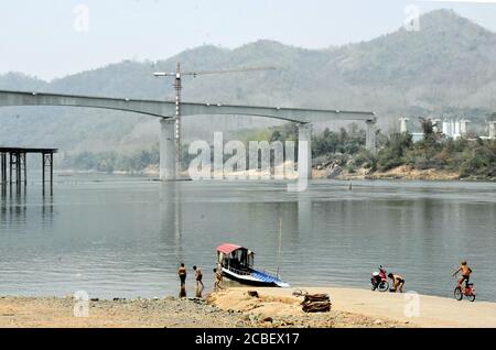 Photo taken on March 11, 2020, in the suburbs of Luang Prabang in Laos shows a railway bridge over the Mekong River under construction. (Kyodo)==Kyodo Photo via Credit: Newscom/Alamy Live News