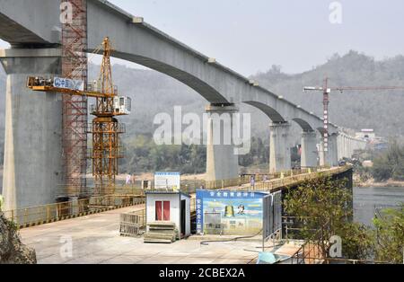 Photo taken on March 11, 2020, in the suburbs of Luang Prabang in Laos shows a railway bridge over the Mekong River under construction. (Kyodo)==Kyodo Photo via Credit: Newscom/Alamy Live News