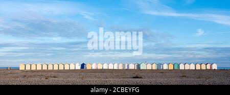 beach huts in cayeux s mer in french normandy under blue sky Stock Photo