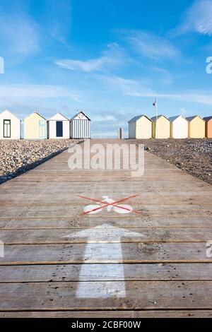 beach huts in cayeux s mer in french normandy under blue sky Stock Photo