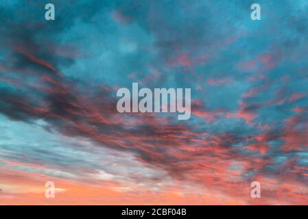 Clouds are colored in different shades at sunset Stock Photo