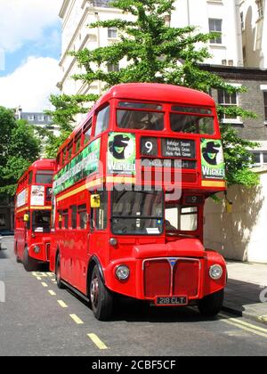 London, England, UK – June 7, 2009. No 9 London Routemaster red double decker buses parked up at a bus stand which are popular travel destination tour Stock Photo