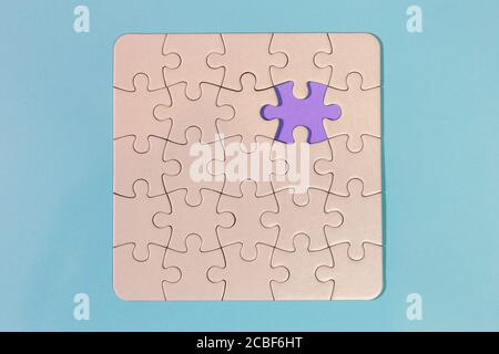 white puzzle with missing tile with light blue background Stock Photo