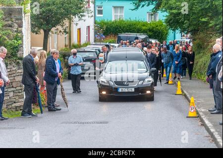 Goleen, West Cork, Ireland. 13th Aug, 2020. Ex Fine Gael TD Paddy Sheehan's  funeral took place at Church of our Lady, Star of the Sea and St. Patrick's in Goleen, West Cork today.   A big crowd of people lined the streets of Goleen as Mr. Sheehan's coffin made its way to the church. Credit: AG News/Alamy Live News Stock Photo