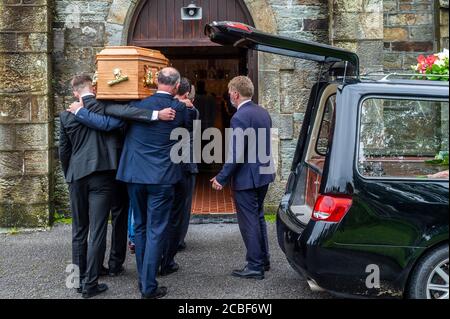 Goleen, West Cork, Ireland. 13th Aug, 2020. Ex Fine Gael TD Paddy Sheehan's  funeral took place at Church of our Lady, Star of the Sea and St. Patrick's in Goleen, West Cork today.   The coffin is carried into the church for the funeral service. Credit: AG News/Alamy Live News Stock Photo