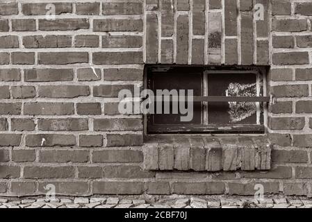 Brick wall and cellar window in black and white, brick wall and one cellar Window Stock Photo