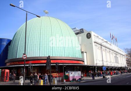 London, United Kingdom, Mar 12, 2011 : Tourists queuing outside Madame Tussauds for the exhibitions at the waxworks and planetarium which is a popular Stock Photo