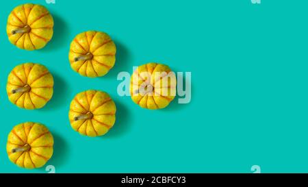 Geometric pattern with pumpkins on a pastel green background. Copy space Stock Photo