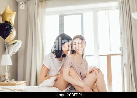 two awesome beautiful girls rejoicing at funny time. happiness, positive mood in the morning. close up photo Stock Photo