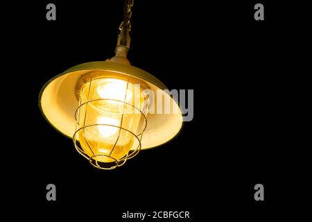 ceiling hanging light lamp isolated on black background Stock Photo