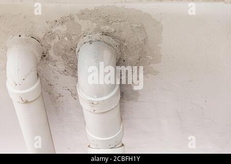 Broken crack pipes water sewer leaks drop Stock Photo