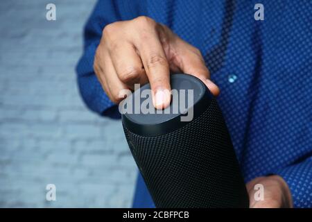 man's hand using smart speaker close up  Stock Photo