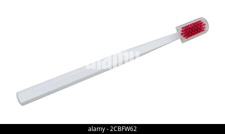 White toothbrush with a transparent plastic lid isolated on a white background Stock Photo