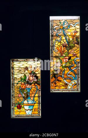19th century American stained glass by unknown designer, part of a design for a stairway with a vase and flowers. Displayed in Macy's Pedway, Chicago. Stock Photo