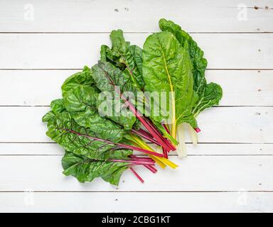 Rainbow chard on white wooden boards. Stock Photo
