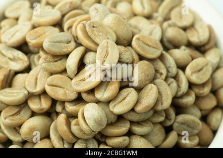 Green coffee beans. Raw state before roasting. Stock Photo