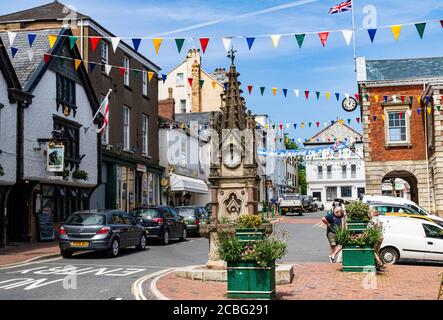 View From the Great Torrington Pannier market Looking into the Town Square, at the Clock, Town Hall and Shops. Torrington Devon, England. Stock Photo