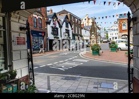 View From the Great Torrington Pannier market Looking into the Square, at the Clock, Town Hall and Shops. Torrington Devon, England. Stock Photo