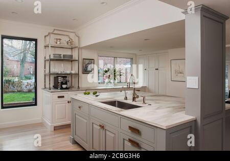 Gray and White Kitchen with Marble Backsplash Stock Photo