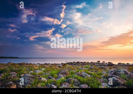 Rocky shores at the sea in sunset light Stock Photo
