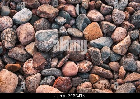 texture with multicolored stones on rocky beach Stock Photo