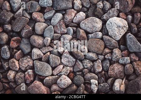 texture with multicolored stones on rocky beach Stock Photo