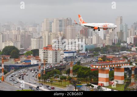 Gol Airlines Boeing 737 on final approach to Congonhas Airport in Sao Paulo, Brazil. Aircraft over Washington Luis Avenue. Brazilian aviation. Stock Photo