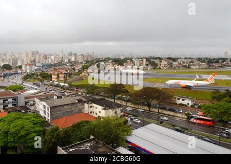 Congonhas Airport in Sao Paulo, Brazil. Central airport with runway and taxiway close to busy avenue. Gol Airlines aircraft. Centrally located CGH. Stock Photo